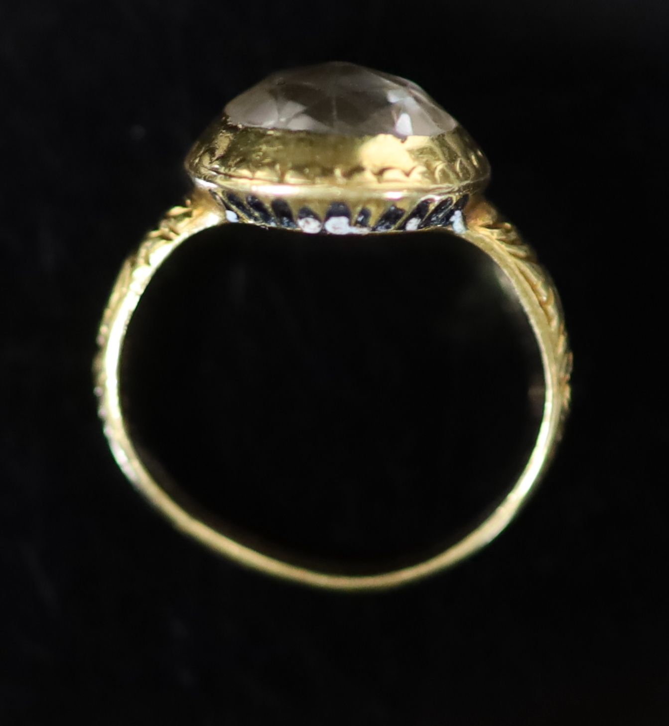 An early George I engraved gold, rock crystal and two colour enamel set memento mori ring